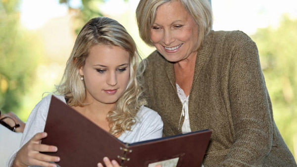 mother and daughter viewing an album